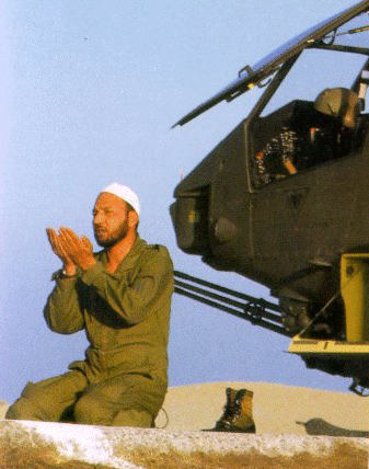 Cobra gunship crew member offers evening prayer